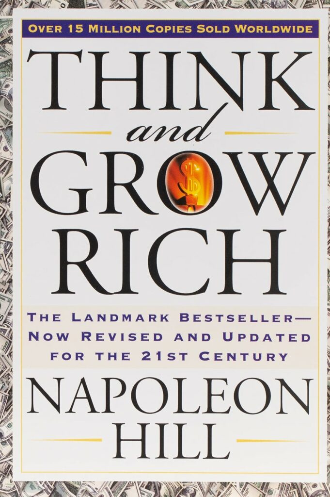 拿破仑·希尔 (Napoleon Hill) 所著《思考致富》一书的封面，标题为黑色大字，背景是美金图片。
